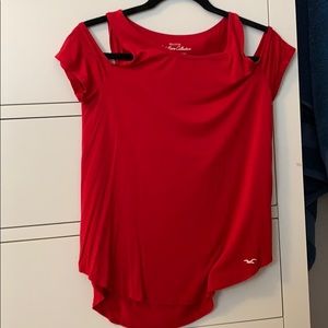 a red cold shoulder shirt
